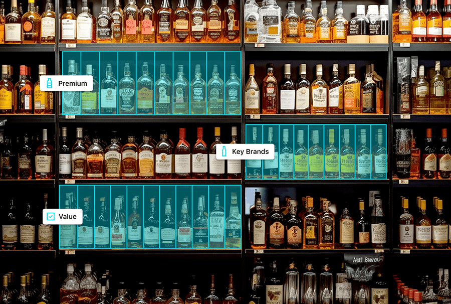 Seasonal liquor store endcap display featuring themed products, promotional signage, and cross-merchandised beverage items.